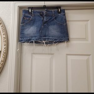 Kali denim distressed skirt is a junior size 5.